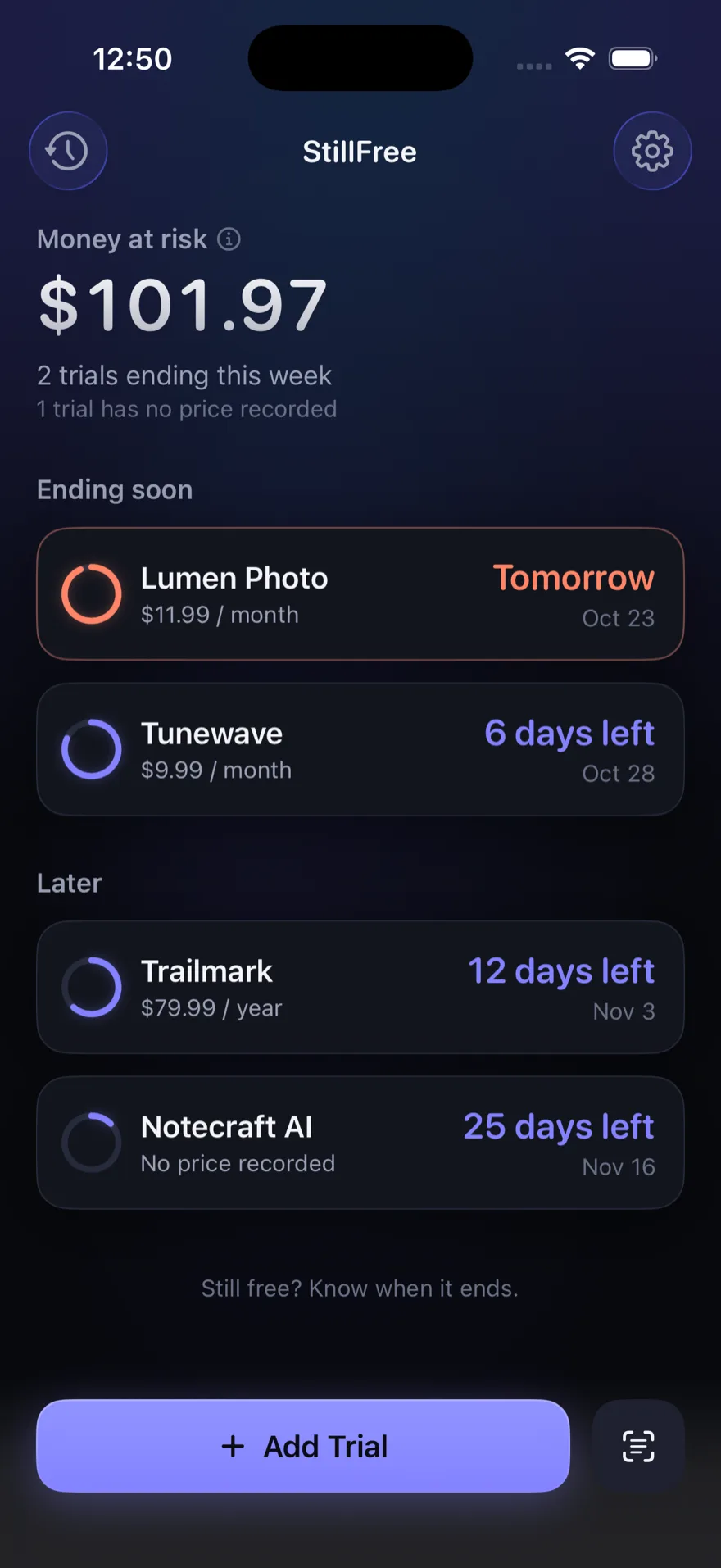 The StillFree home screen in dark mode: money at risk, trials ending soon, and the trials due later.